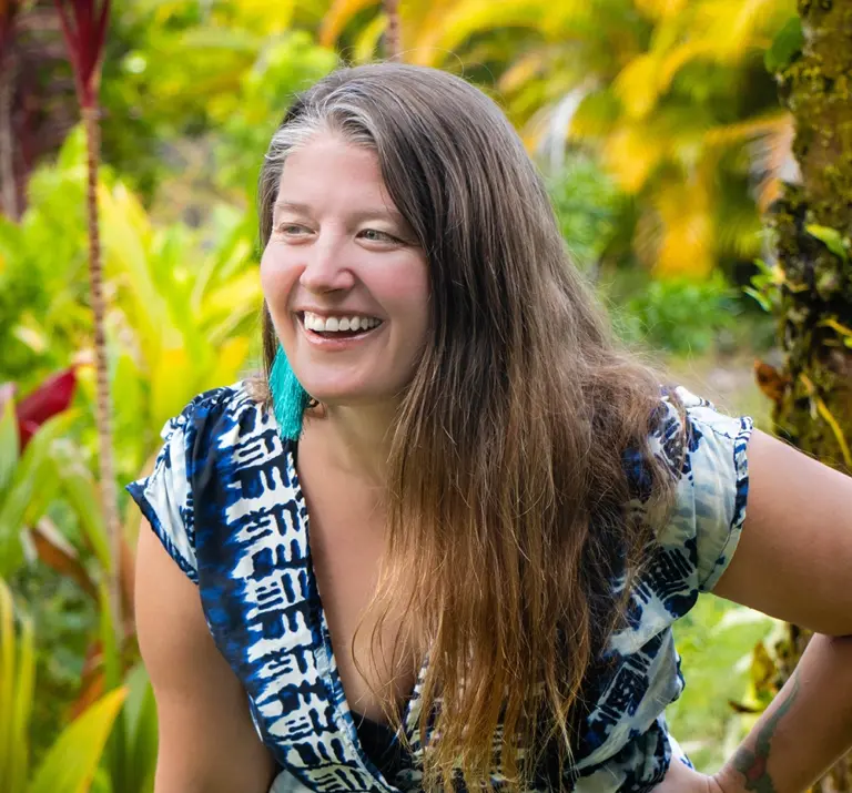 Wynd headshot with colorful tropical background